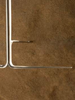 Tube cutout shelving, rails and racks developed and produced by ErtlundZull. Designed by Thorben Groeble with B+ for the Trussardi Flagship store in Milan, Italy. ErtlundZull