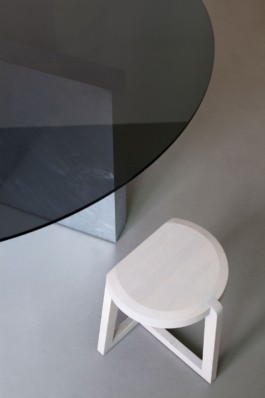 A round table with smoke glass top, a curved galvanized steel staircase and crashed ceiling light for Bus Group Studio, Berlin 2019. Design by ErtlundZull and Atelier Fanelsa. Photo by ErtlundZull and Atelier Fanelsa. ErtlundZull
