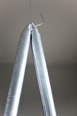 A round table with smoke glass top, a curved galvanized steel staircase and crashed ceiling light for Bus Group Studio, Berlin 2019. Design by ErtlundZull and Atelier Fanelsa. Photo by ErtlundZull and Atelier Fanelsa. ErtlundZull