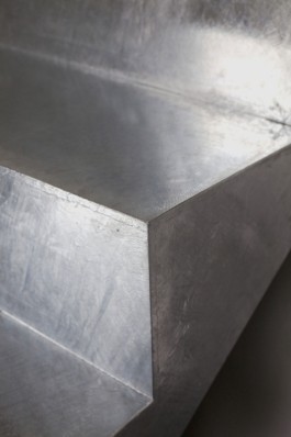 A round table with smoke glass top, a curved galvanized steel staircase and crashed ceiling light for Bus Group Studio, Berlin 2019. Design by ErtlundZull and Atelier Fanelsa. Photo by ErtlundZull and Atelier Fanelsa. ErtlundZull