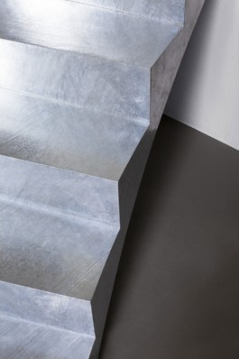 A round table with smoke glass top, a curved galvanized steel staircase and crashed ceiling light for Bus Group Studio, Berlin 2019. Design by ErtlundZull and Atelier Fanelsa. Photo by ErtlundZull and Atelier Fanelsa. ErtlundZull